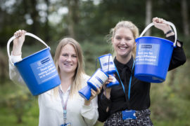 Fundraising team with donation buckets