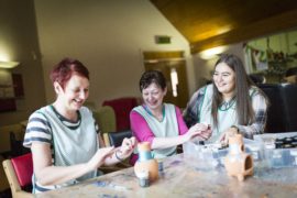 Daycare volunteers painting