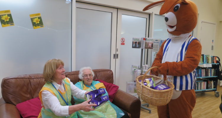 The Easter bunny with volunteers at Heald Green