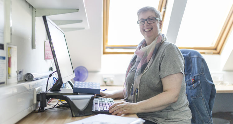 Staff member at desk