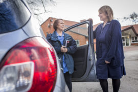 Staff members in the car park