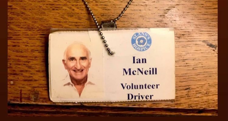 Lindi's dad's volunteer ID badge, with the landyard in the shape of a heart.